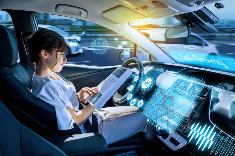 young woman using a smart phone in a autonomous car.  self drivi